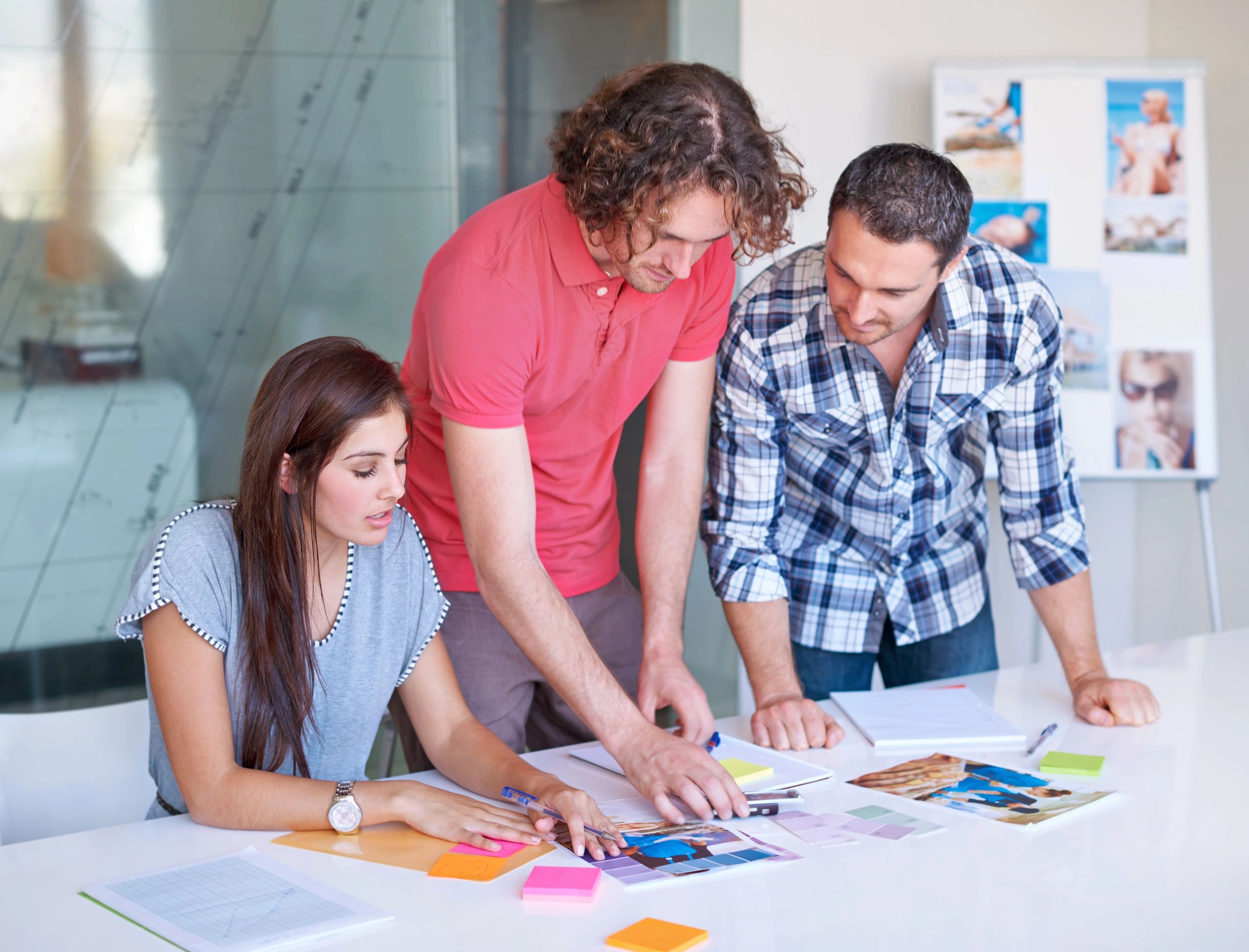 Creative team selecting a color scheme in a boardroom