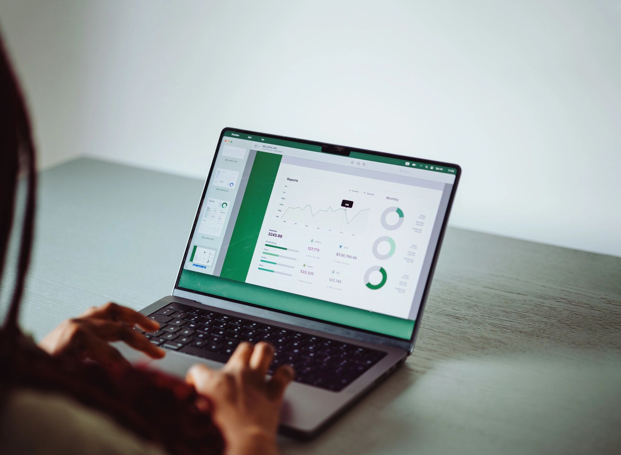 Analyst reviewing strategy and performance data on a laptop